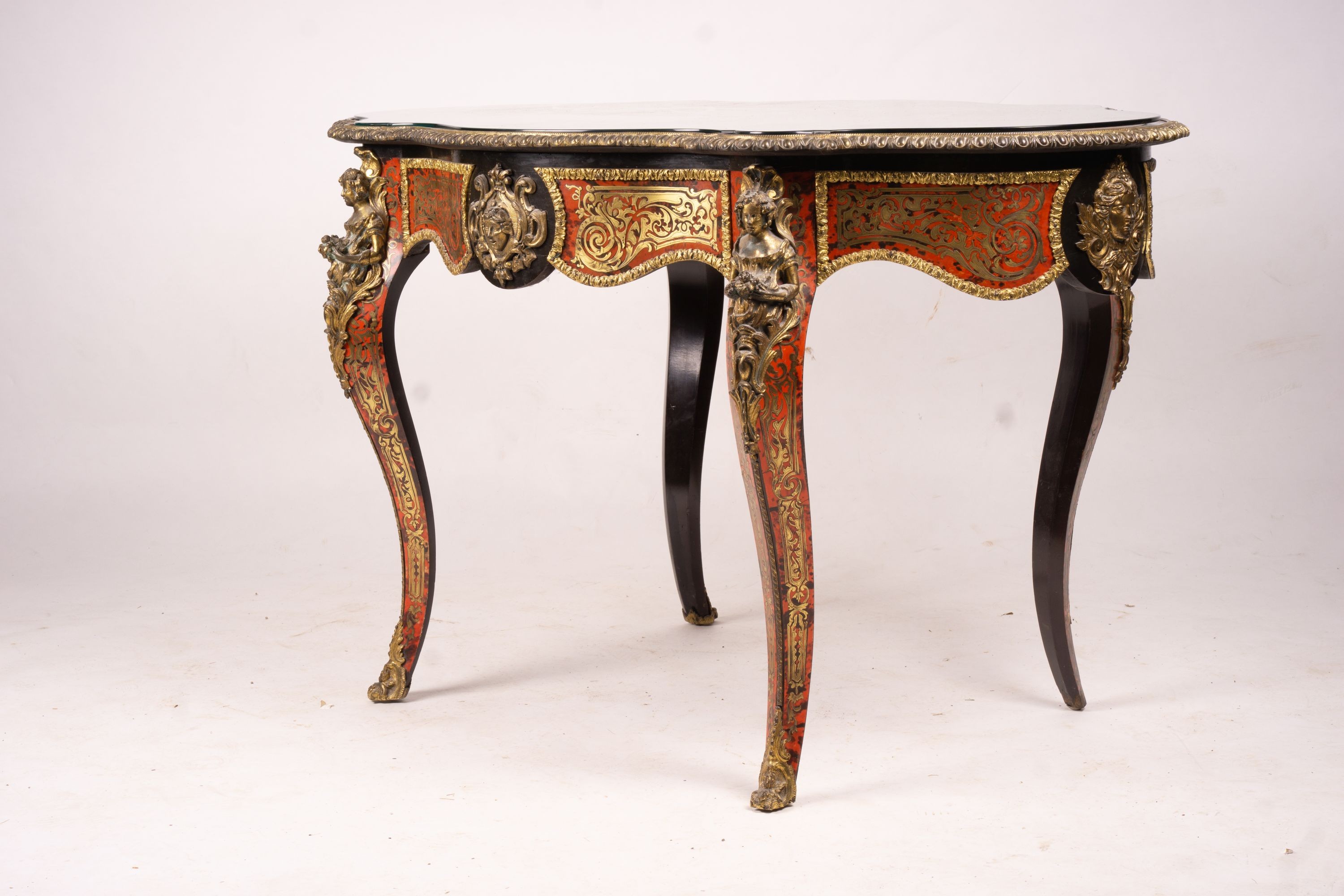 A 19th century Boulle inlaid centre table with shaped oval top, width 130cm, depth 78cm, height 76cm